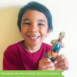 A customer photo of a young dark-haired boy, smiling and holding up a completed 4D Human Anatomy Torso Puzzle. The head is halved to show the skull with muscles on the left, and the skin covered head on the right. The completed torso is light skin colored on the outside, but the entire center and neck are open to show the insides, including; a ribcage, liver, pancreas, and intestines. The stand the torso sits on is black and rectangular.