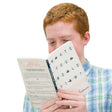 A young red-haired boy is reading the What’s Your Worldview book. The cover is a light grayish with some dark marbling. The title of the book covers most of the cover and each letter is inside brackets, resembling a test sheet with one bracket colored in with a marking on each line. There is a red rectangle, with text inside, between the title and author at the bottom. The back has a red rectangle with the question “How do you view the world?” at the top, and paragraphs of text below.