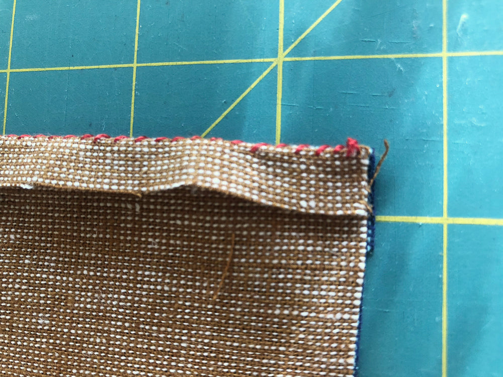 Clipped thread at the knot at the end of the first round of stitches