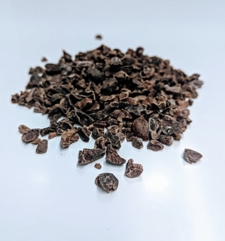 Cacao nibs on white background