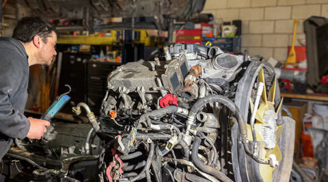 Chris inspecting an engine