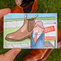 Drawing of penis dressed in a suit selling real estate