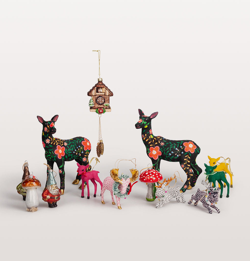 Christmas animal decorations by Cody Foster. Hand painted fawn, moose and jack rabbits with forest mushroom decorations, gnomes and cuckoo clock. wagreen.co.uk