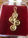 14k and 10 k gold Swirly-Curly Pendant.