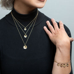 Model wearing 14K gold reflections jewelry