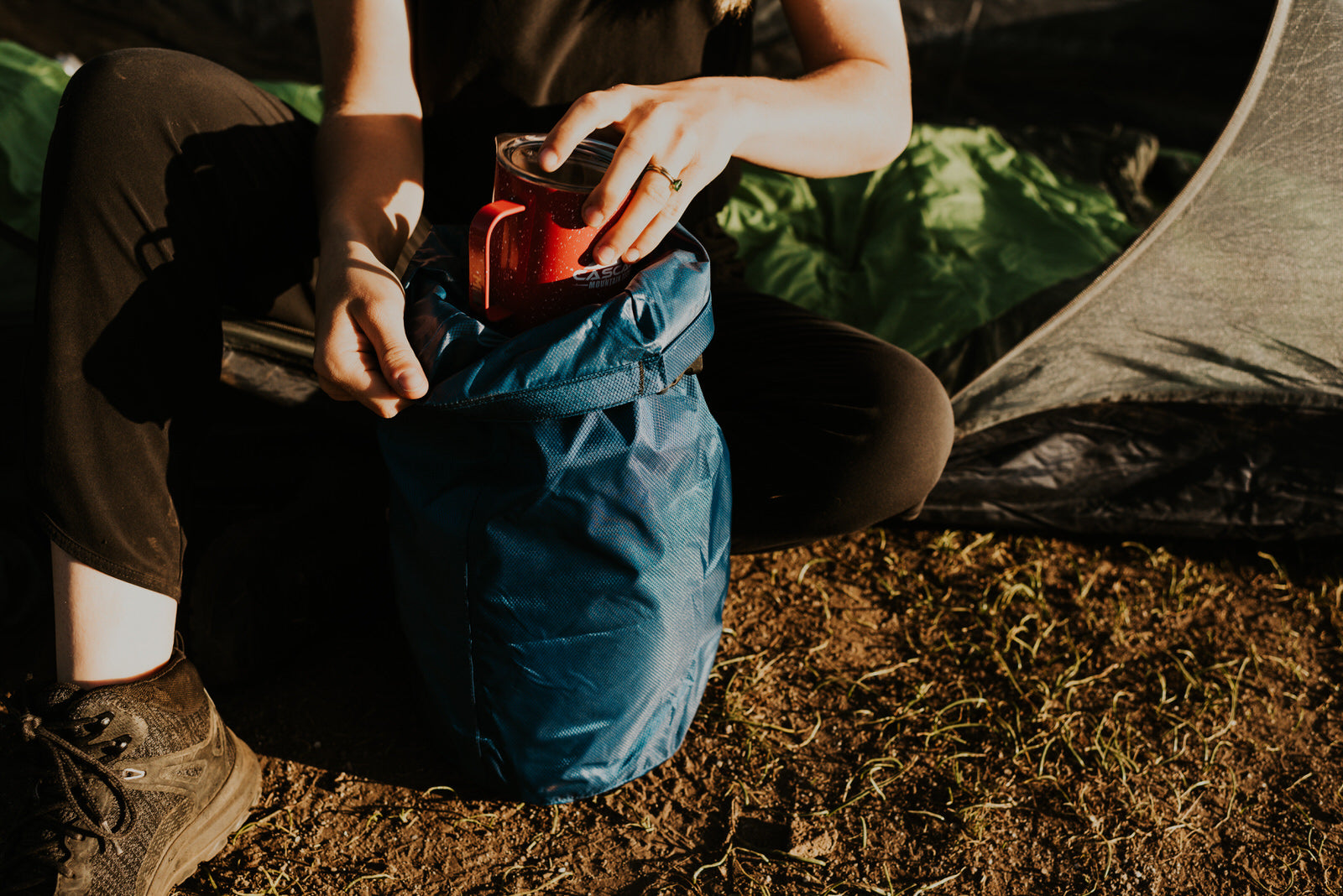 Woman packing backpack