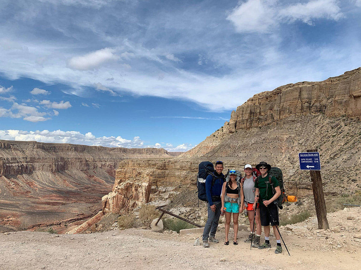 standing on the rim of the grand canyon hiking to havasupai