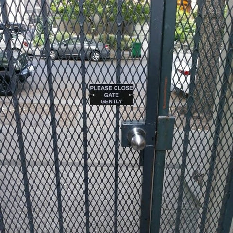 customer installed sample sign Please Close Gate Gently