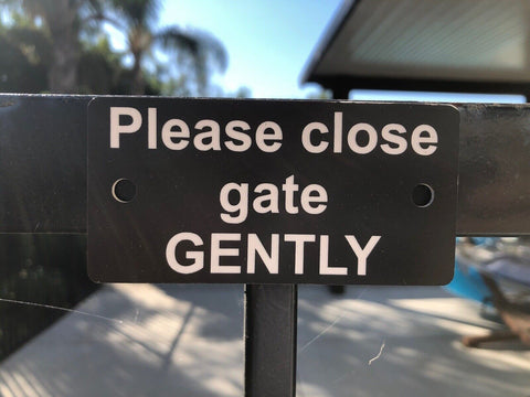 customer installed sample sign Please Close Gate Gently