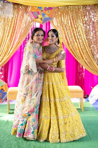 Crystal with her mom in the Saffron and Keya Lehengas 