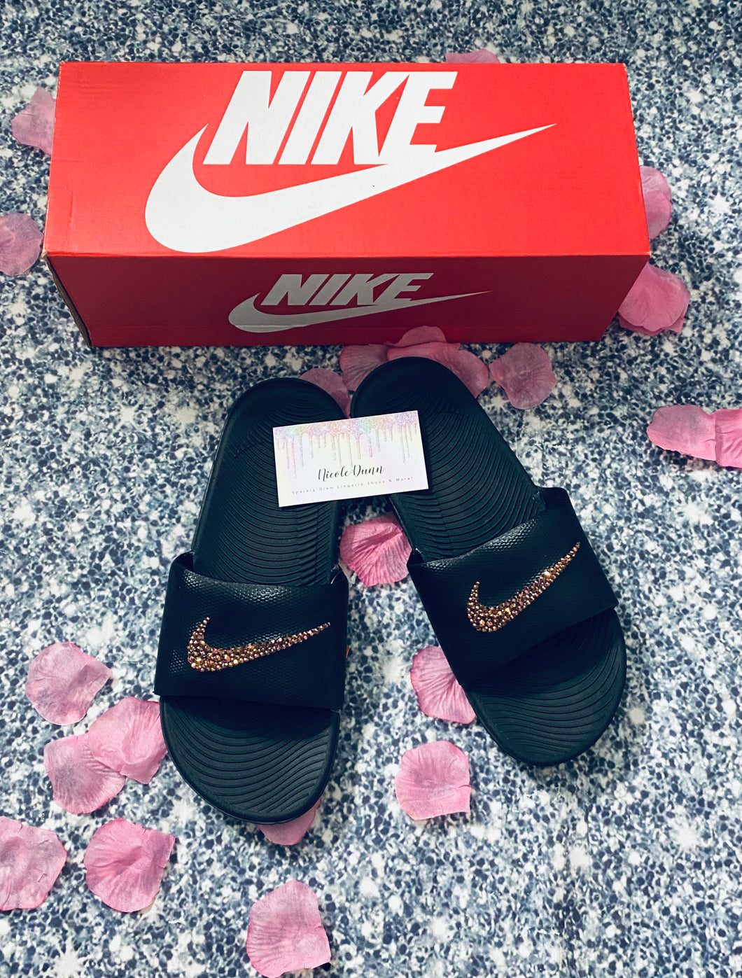 black red and gold nike slides