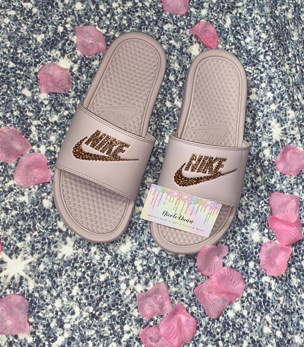 pink and gold nike slides