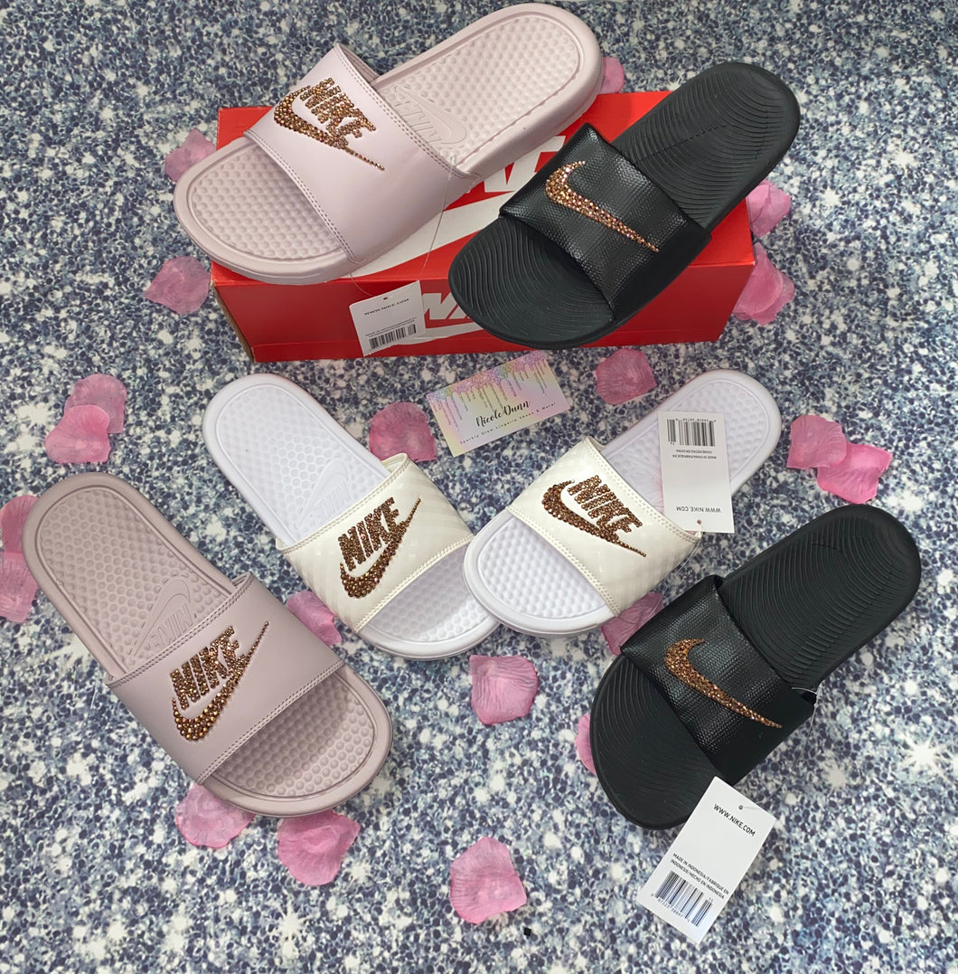 white and rose gold nike slides