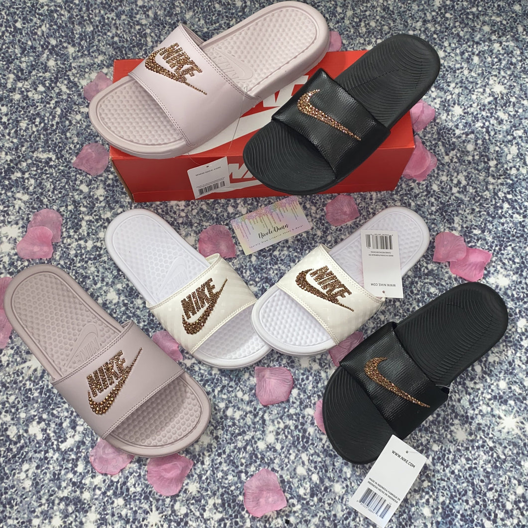 pink and gold nike slides