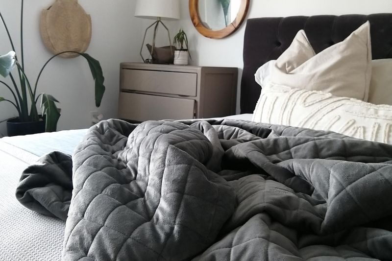 a weighted blanket on a bed