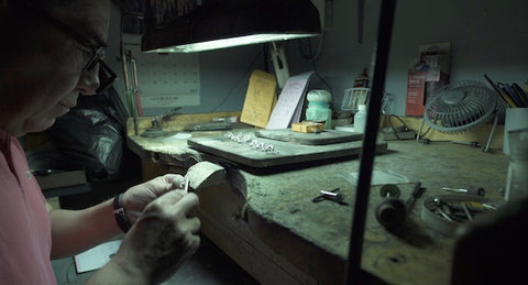 jeweler master working at bench