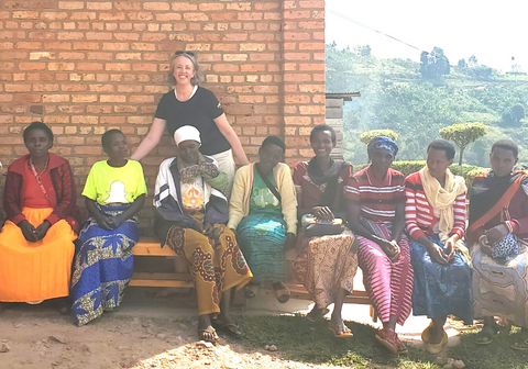 Group of female Rwandan coffee farmers with Owens Coffee's Liz