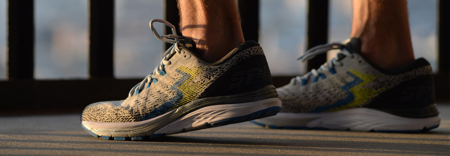 Ultra close-up of man in men's 361 Spire running shoes during golden hour