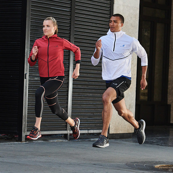 Man and woman running together in city in 361 running shoes