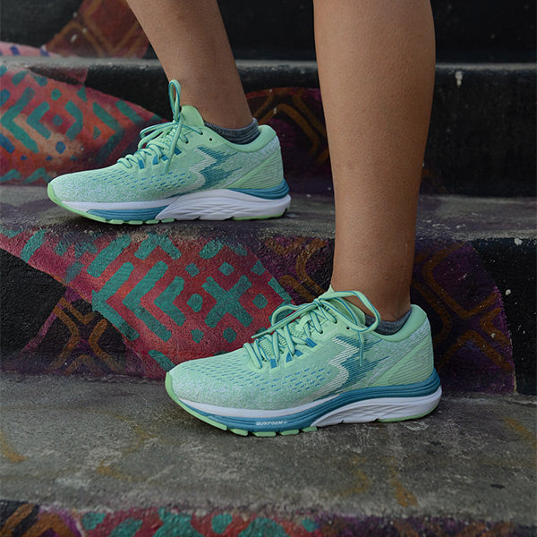 Close-up of woman on stairs wearing women's 361 Spire 4 running shoes