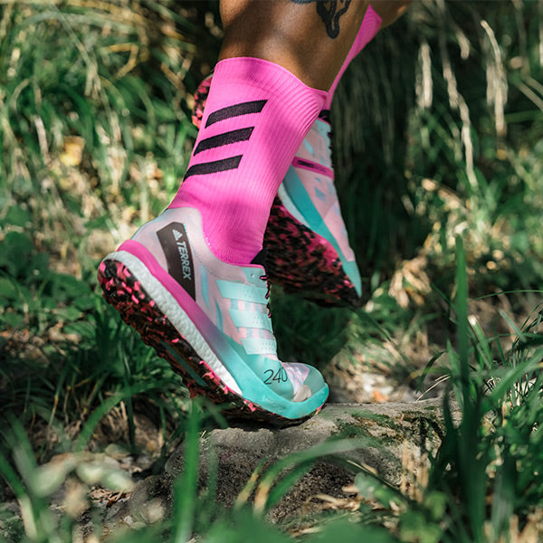 Close up of man running in adidas Terrex men's trail running shoes