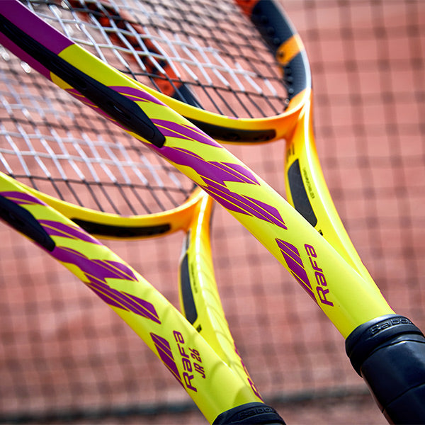 Shot of two Babolat Pure Aero Rafa tennis racquets
