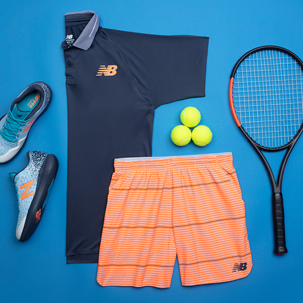 Flatlay of New Balance Tennis Clothing on tennis court