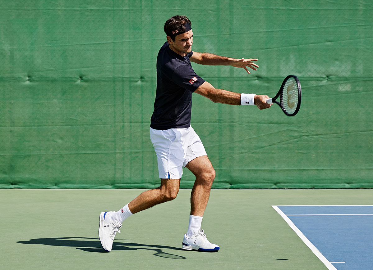 Shot of Roger Federer playing tennis in the On Roger Pro tennis shoes