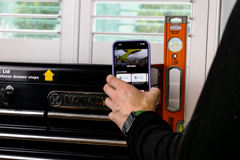 LoveHandle PRO being used to stick a cellphone to a metal toolbox