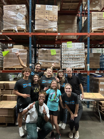 The LoveHandle Team, along with family and friends volunteer at the Houston Food Bank.