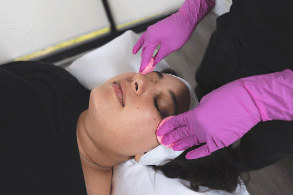 Esthetician providing a facial service 