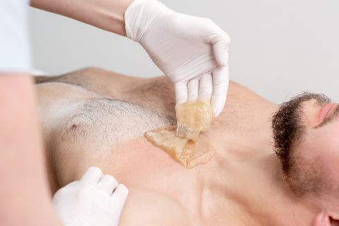 Sugaring chest service on a male 