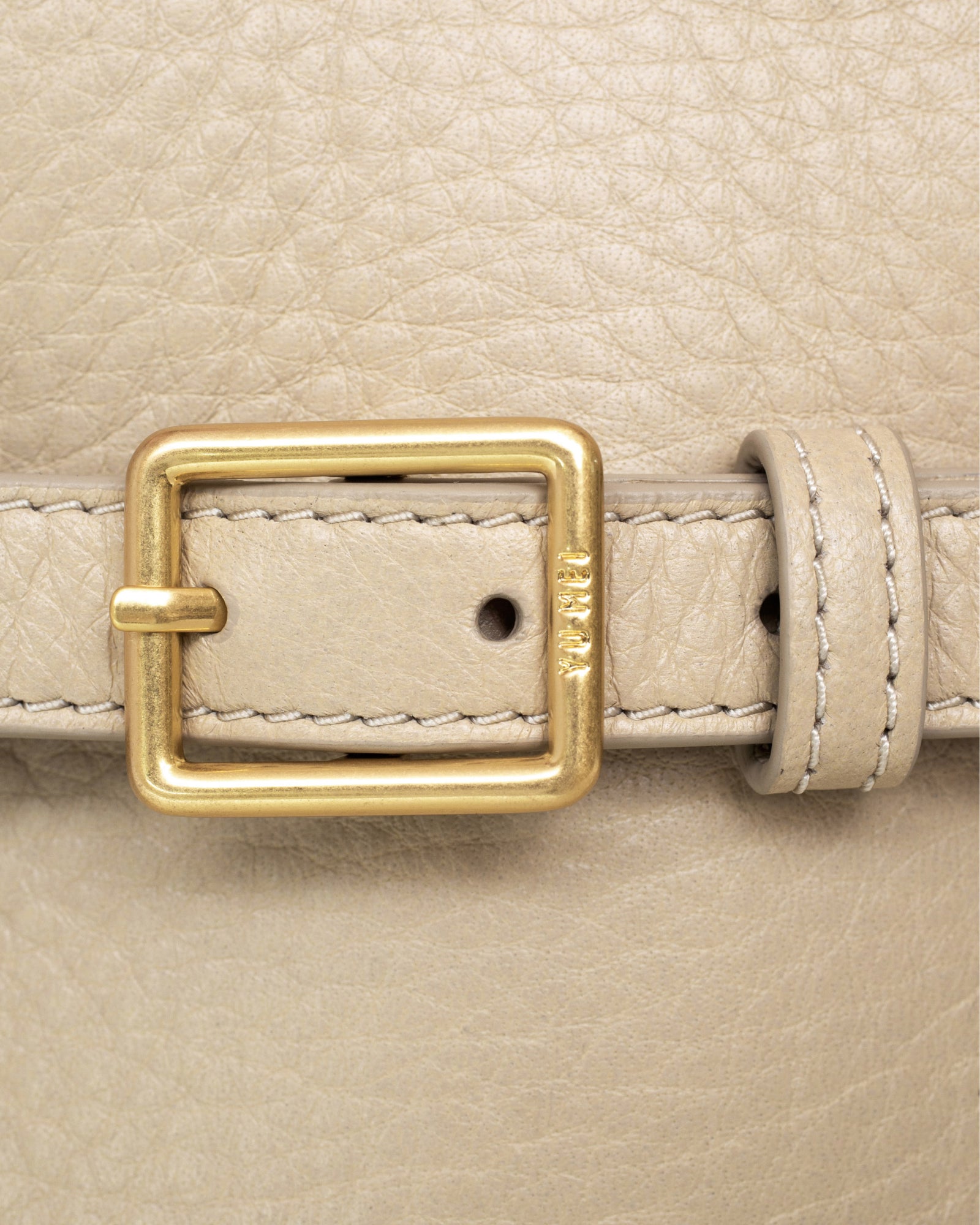 Adjustable buckle detail on side gussets