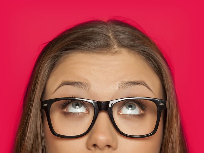 woman with bright eyes looking up