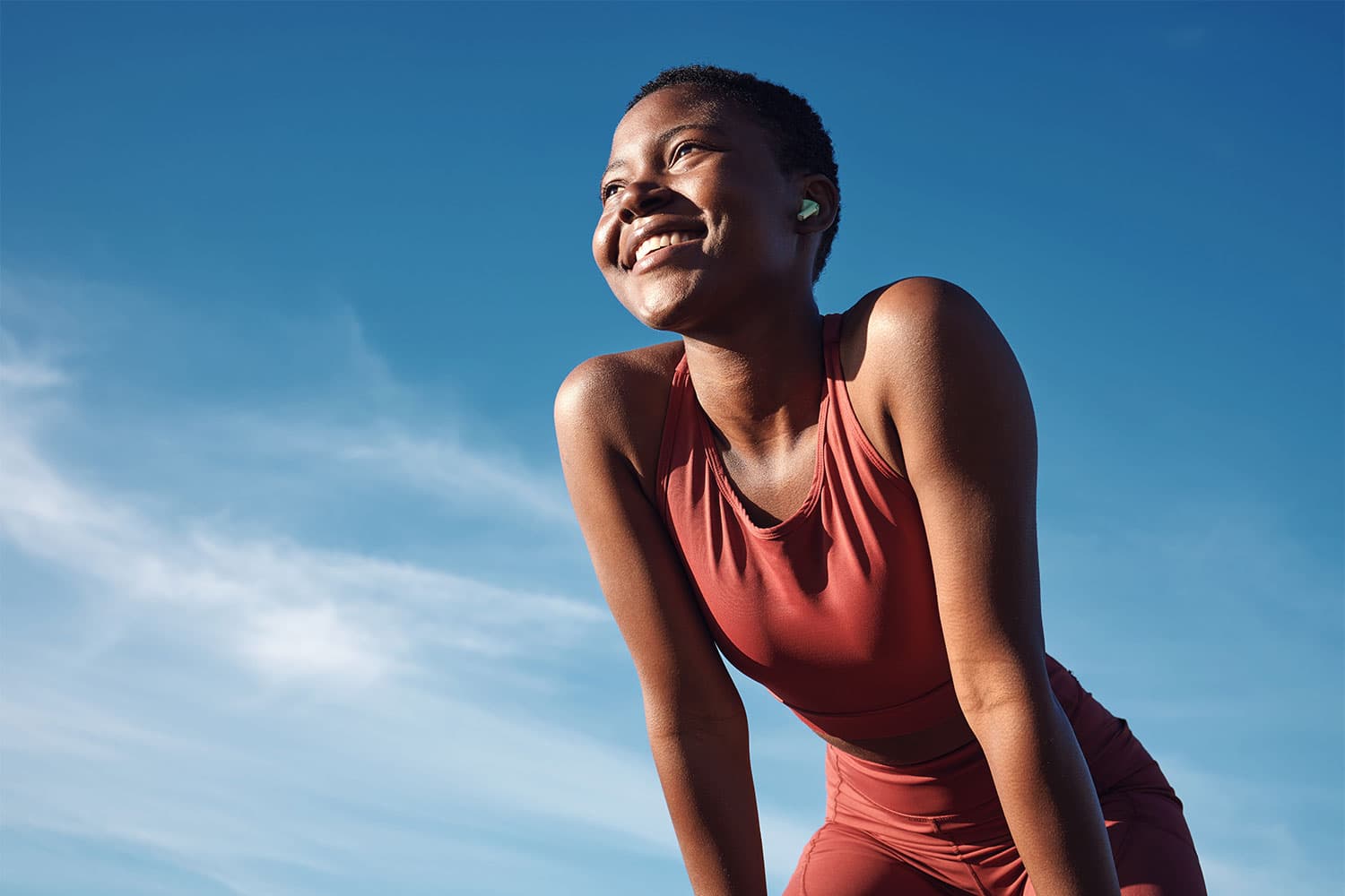 healthy African woman smiling after exercise