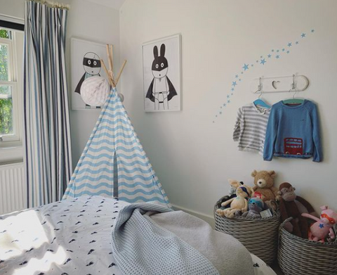 Blue themed nursery with pale blue wall stickers