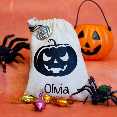 White personalised Halloween treat bag with black pumpkin decoration