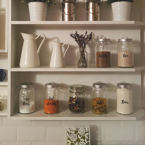 Pantry shelves with containers labelled with Nutmeg word stickers