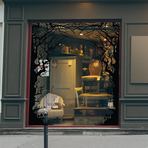 A shop window decorated for Halloween with spooky window stickers by Nutmeg Studio