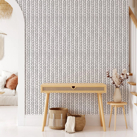 Black and white Chevron Self-Adhesive Wallpaper above an oak console table