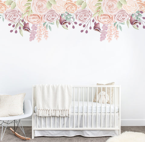 Floral wall mural on a white wall above a white cot