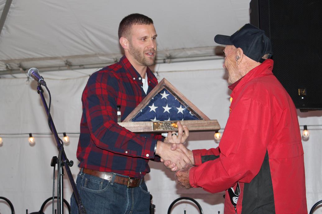 Charlie Baker receiving honorary American Flag shadow box with sand from Iwo Jima