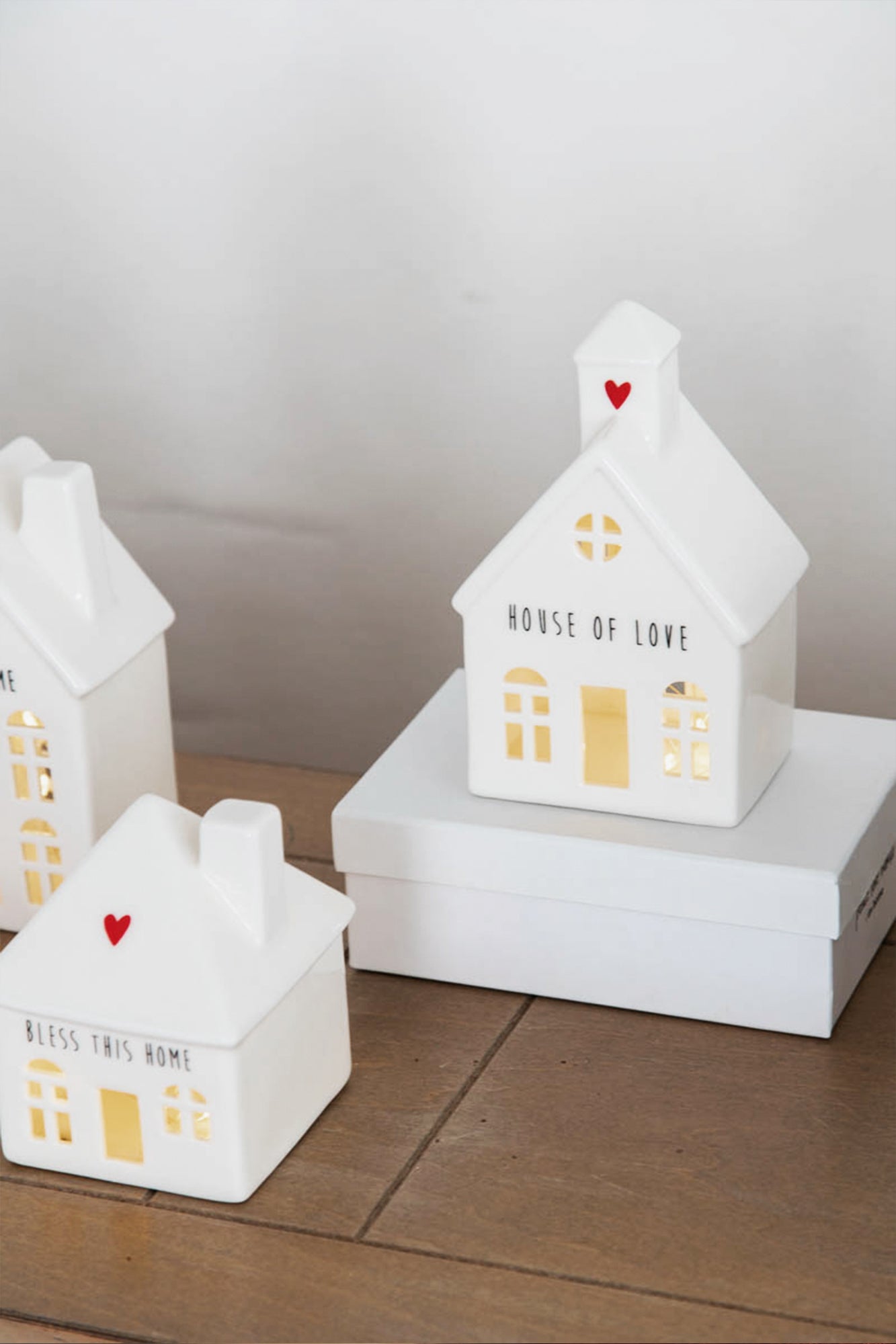 white ceramic lighted houses