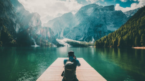 Man photographing mountains