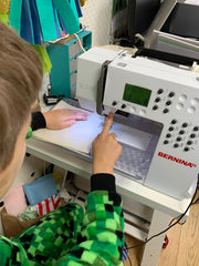 Teaching children to use a sewing machine & making face masks