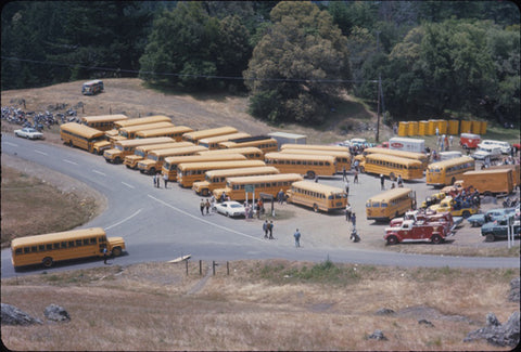 School buses transported everyone to the gig. 