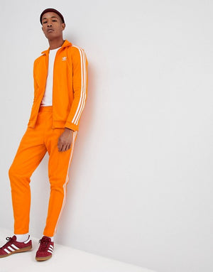 white and orange adidas tracksuit