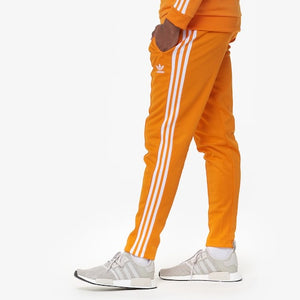 orange and black adidas tracksuit