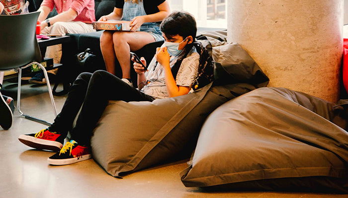 3D animation student relaxes on a Fatboy beanbag at the School of Digital Arts, Animation and Design in Montreal.