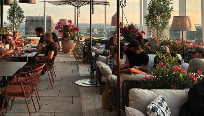 "Rose Orange terrace on 44th floor of Place Ville Marie, Montreal, with panoramic views and Newgarden's Sisine 70 fixtures.